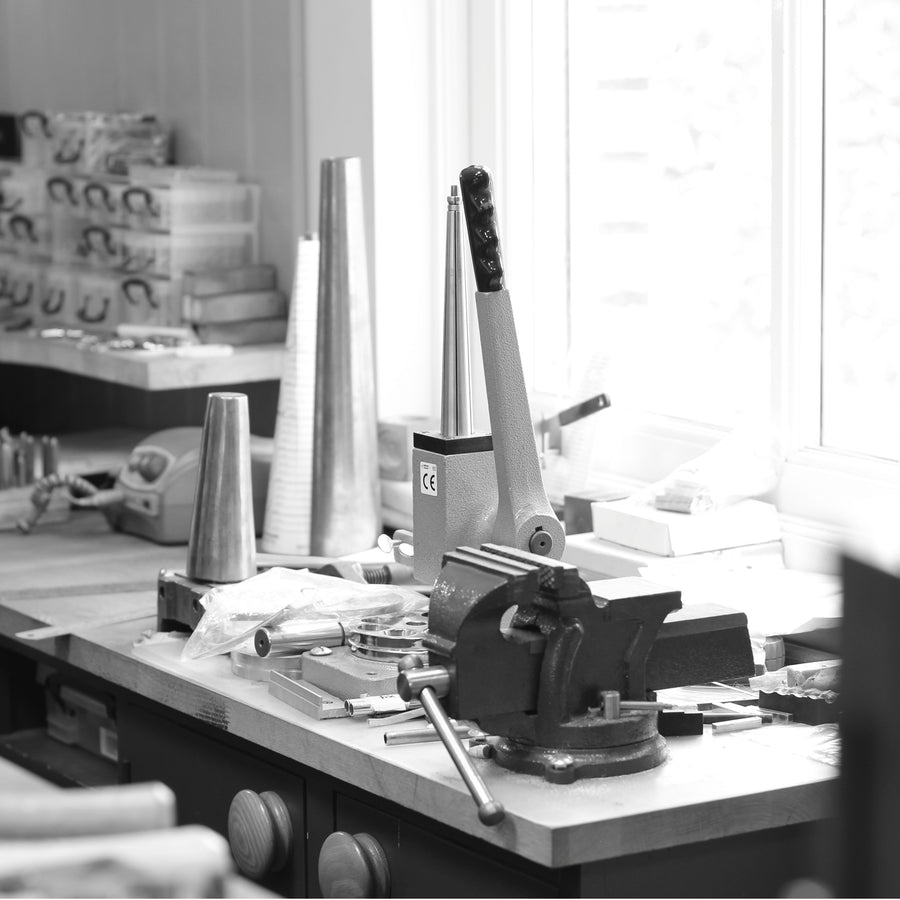 Tools arranged on a jeweller’s studio workbench