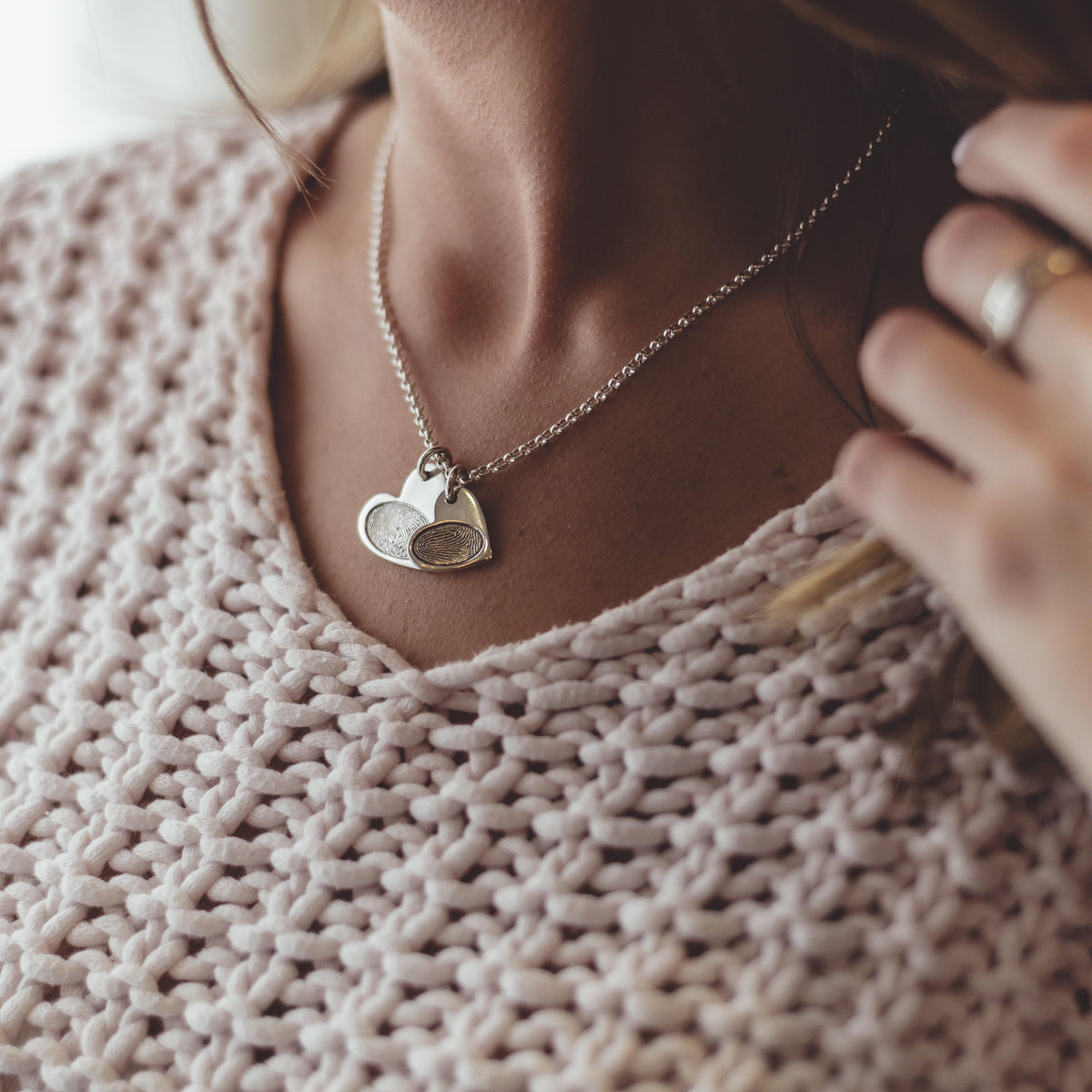 Silver Heart Fingerprint Necklace worn close to the neckline