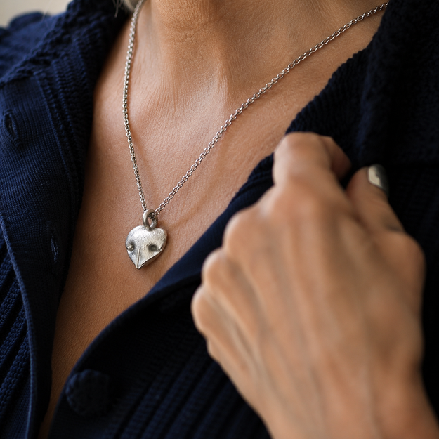 Silver Snozza Regular Heart Necklace worn to show the pendant’s size and shape.