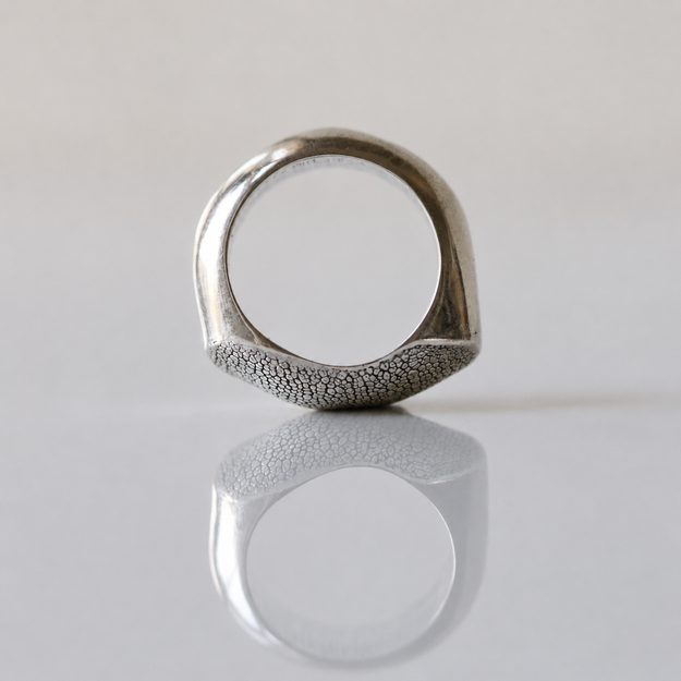 Side view of the Fuller Silver Snozza Dog Nose Impression Ring showing its organic shape.