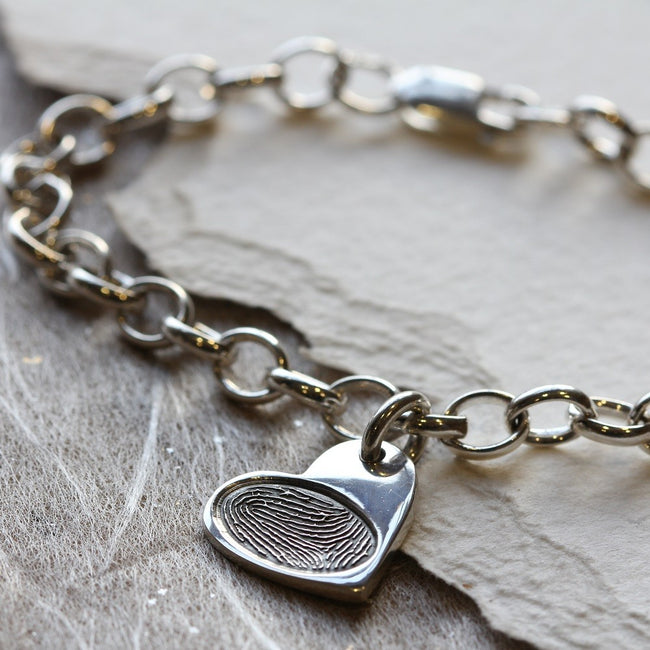 Silver bracelet with a heart-shaped fingerprint charm