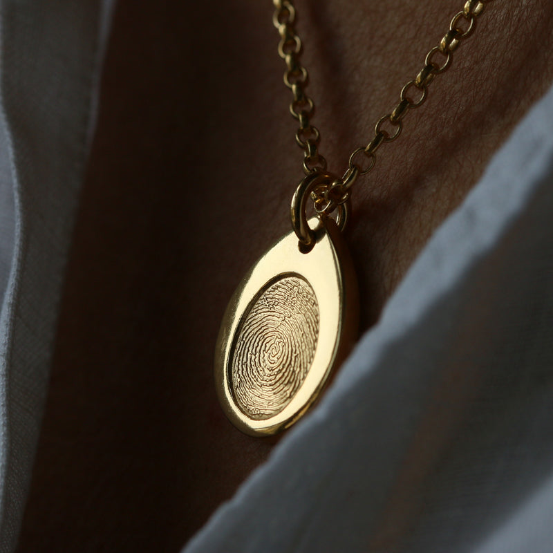 Close-up of a gold vermeil Teardrop Fingerprint Necklace