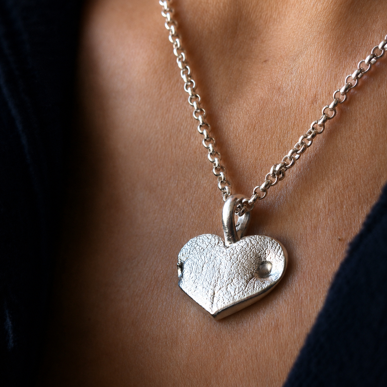 Large Silver Snozza Wide Heart Dog Nose Impression Necklace worn on a sterling silver chain.