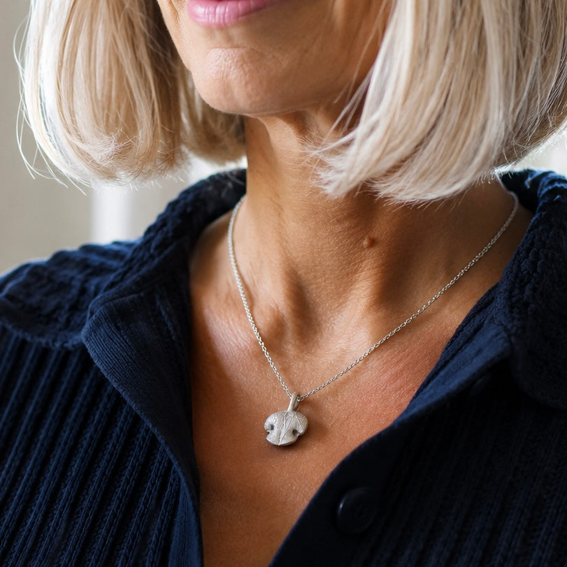 Silver Snozza Rounded Dog Nose Impression Necklace handcrafted from a dog’s nose impression.