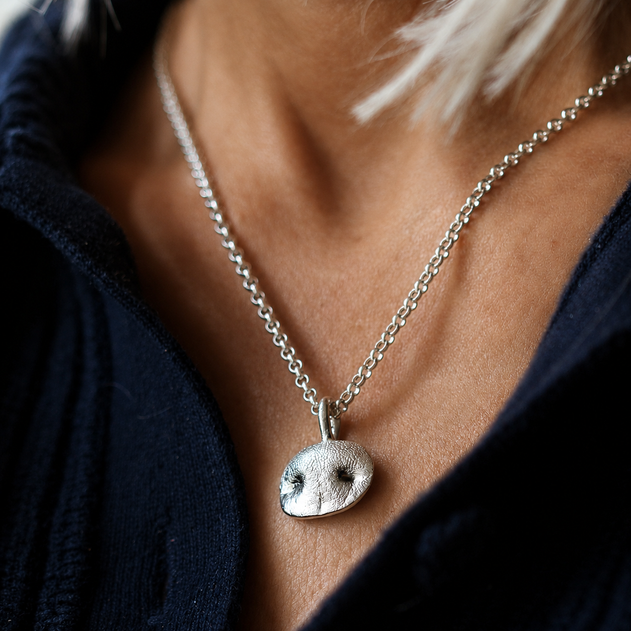 Silver Snozza Oval Dog Nose Impression Necklace worn on a 16-inch sterling silver chain.