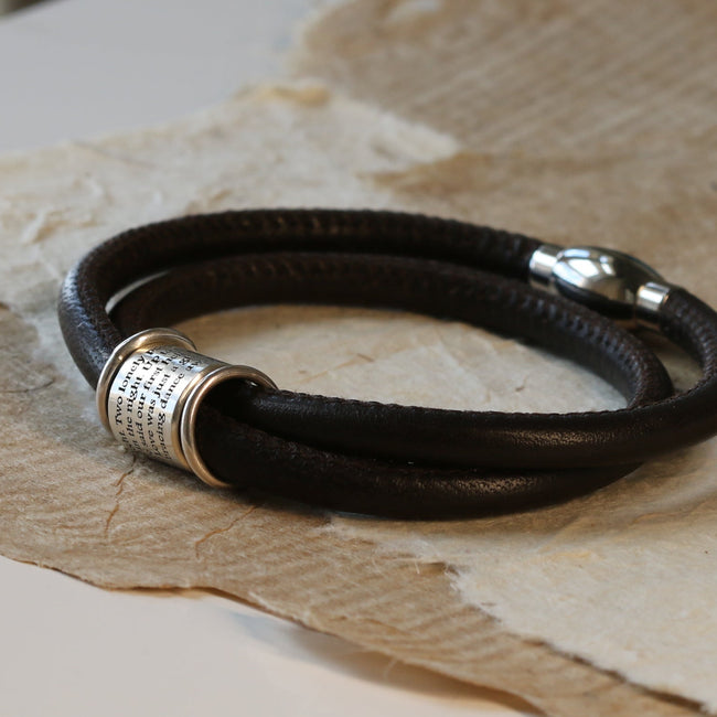 Black double-wrap leather bracelet with an engraved silver bead