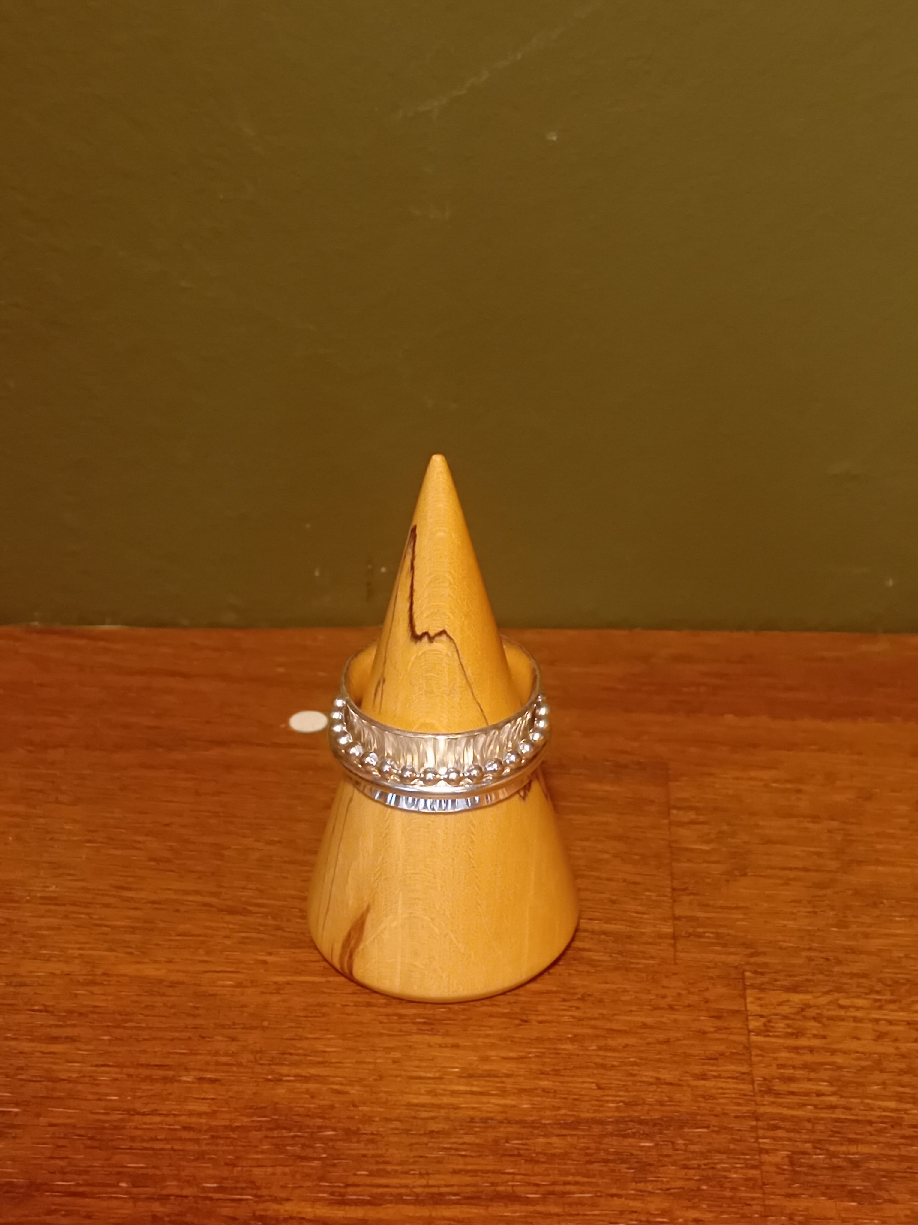 Textured spinner ring one ball wire one plain spinning rings