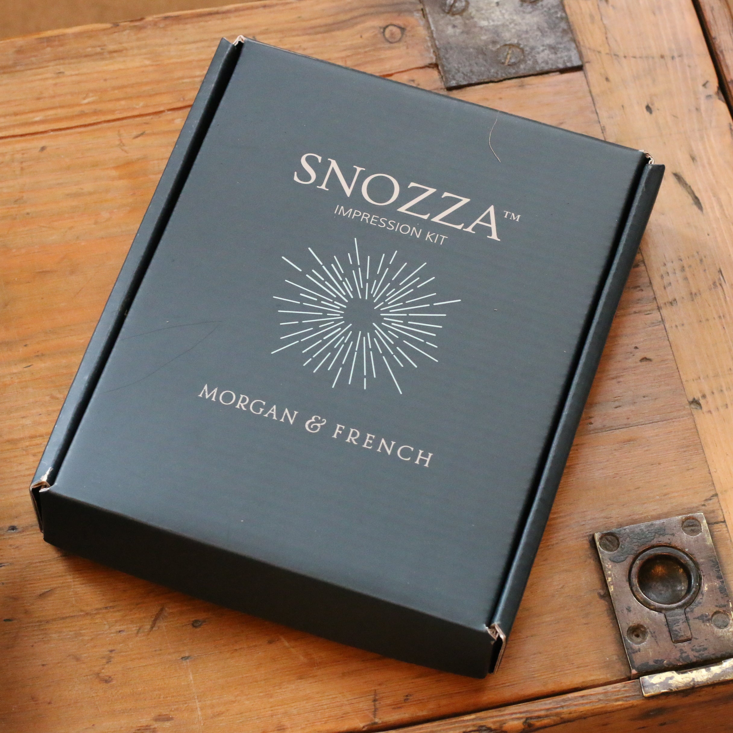 Label: Snozza™ Impression Kit gift box, included with every Snozza piece