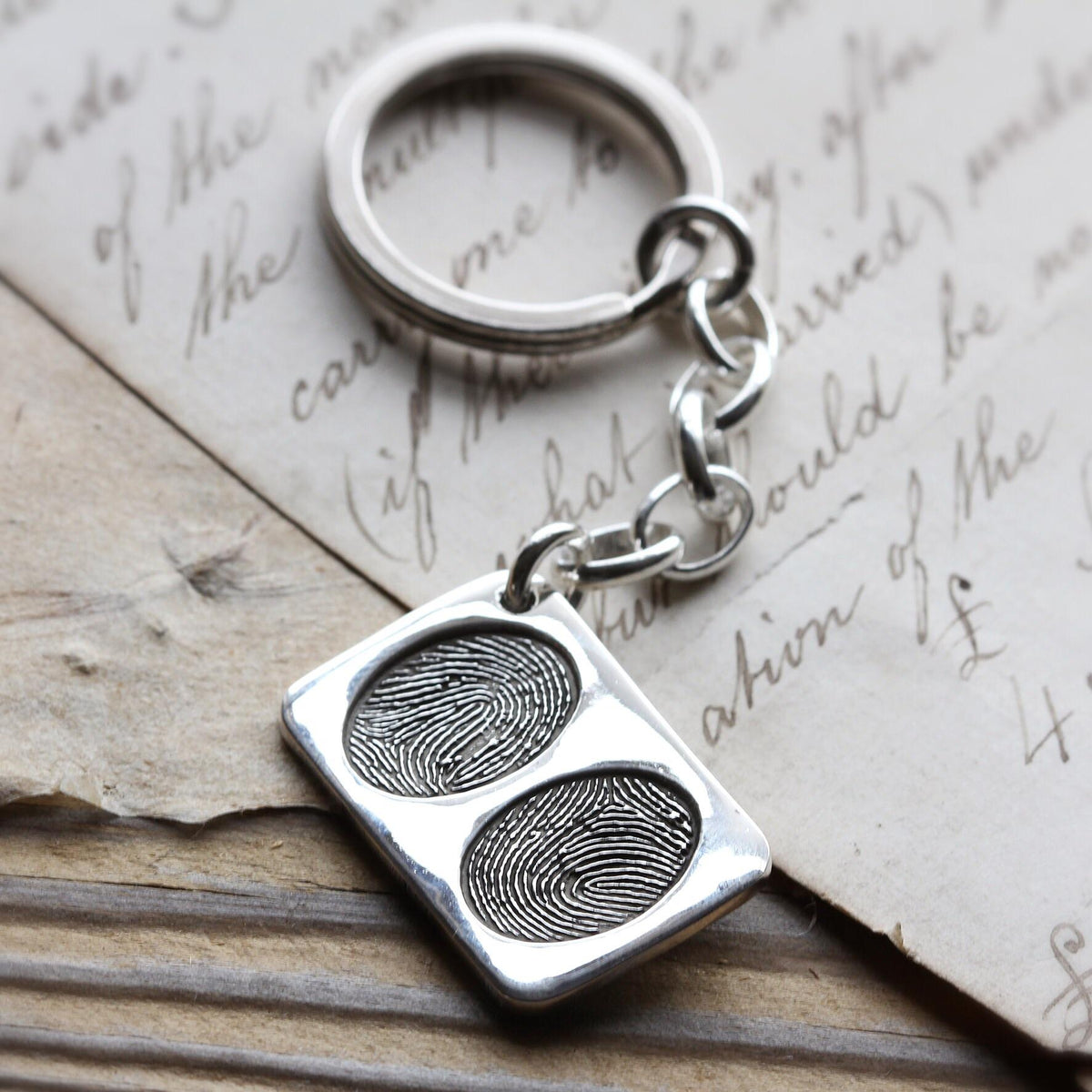 Double Fingerprint Keyring with two prints on a silver rectangle