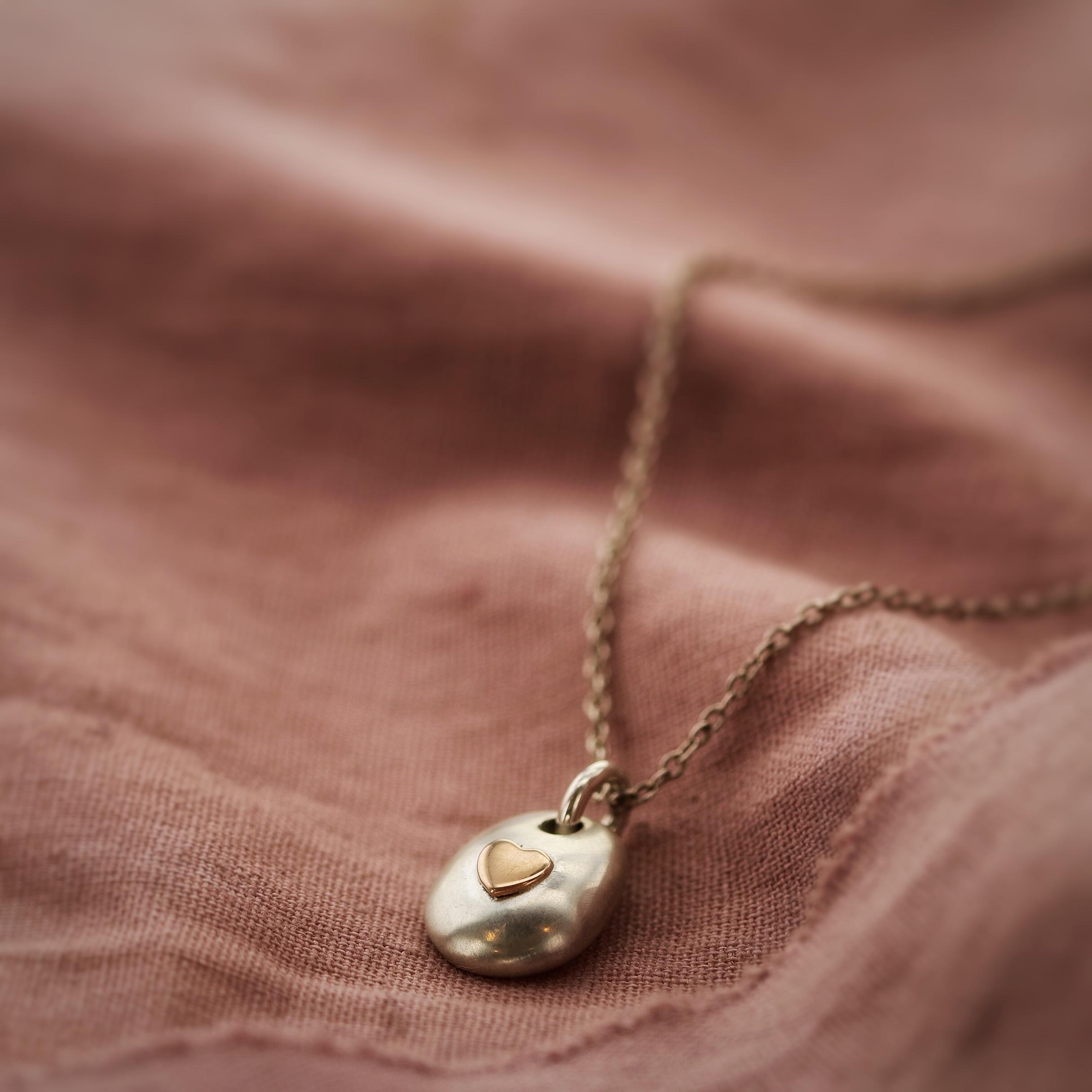 Ashes pebble necklace with 9ct gold heart 