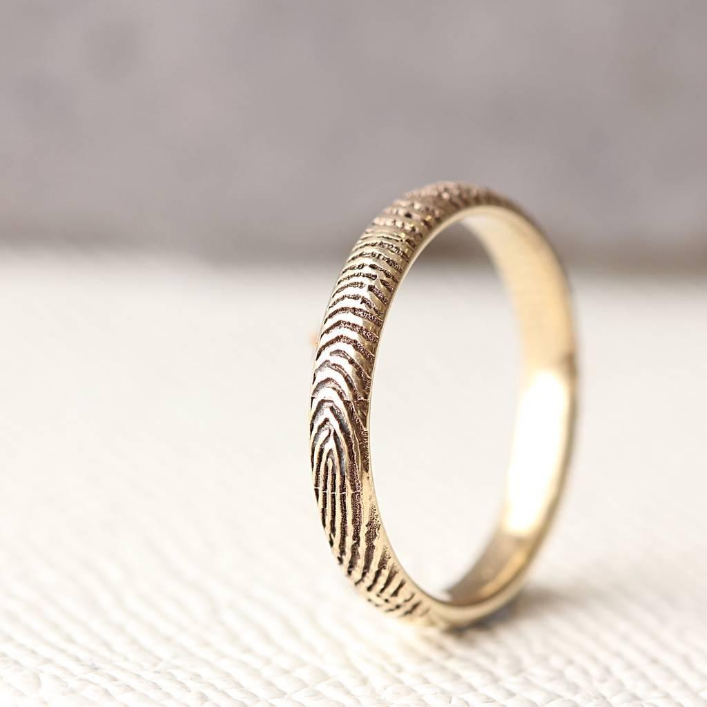 Slender solid gold fingerprint ring